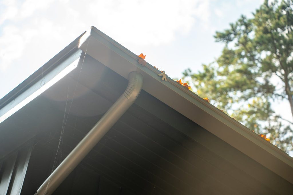 Box gutter and downspout at the eave