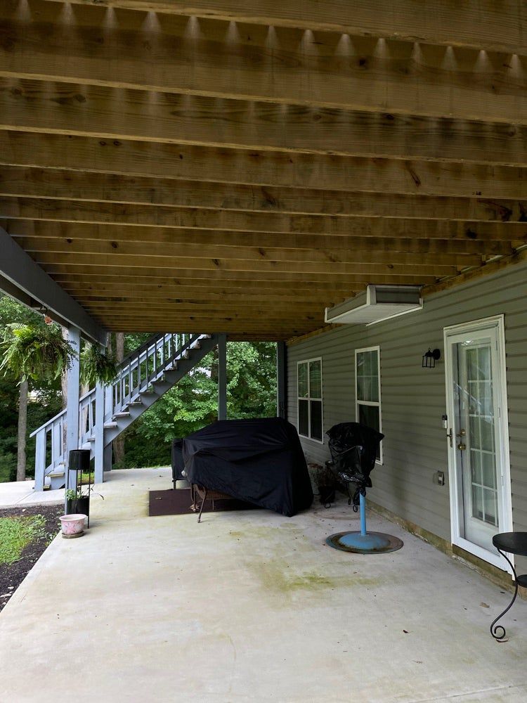 Open deck boards before an under deck ceiling